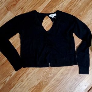 Cute NWOT No Comment black long sleeve open zip back.  Crop top
